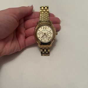 Used, fitted gold Michael Kors watch (no battery)